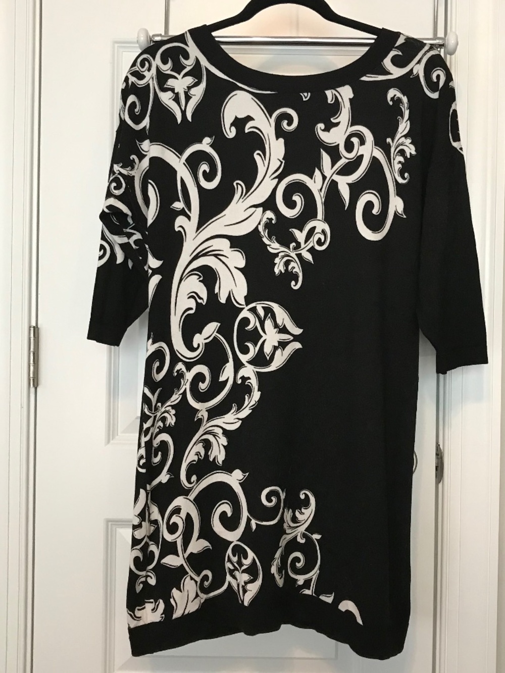 WHBM black 3/4 sleeve boat neck sweater dress with white scrollwork design (M)
